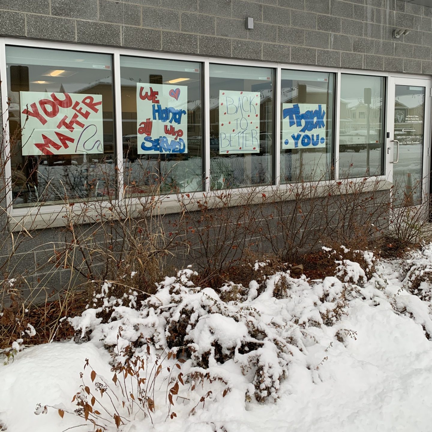 windows with supportive signs in them